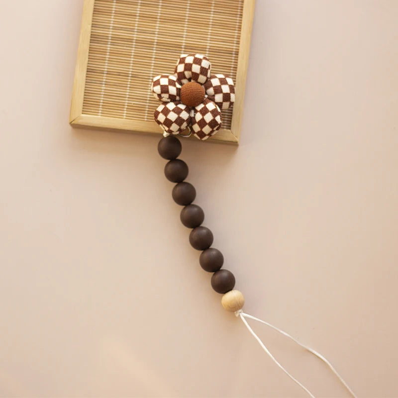 Clip para chupete Kalinatur™ de silicona con forma de flor – Mordedor natural