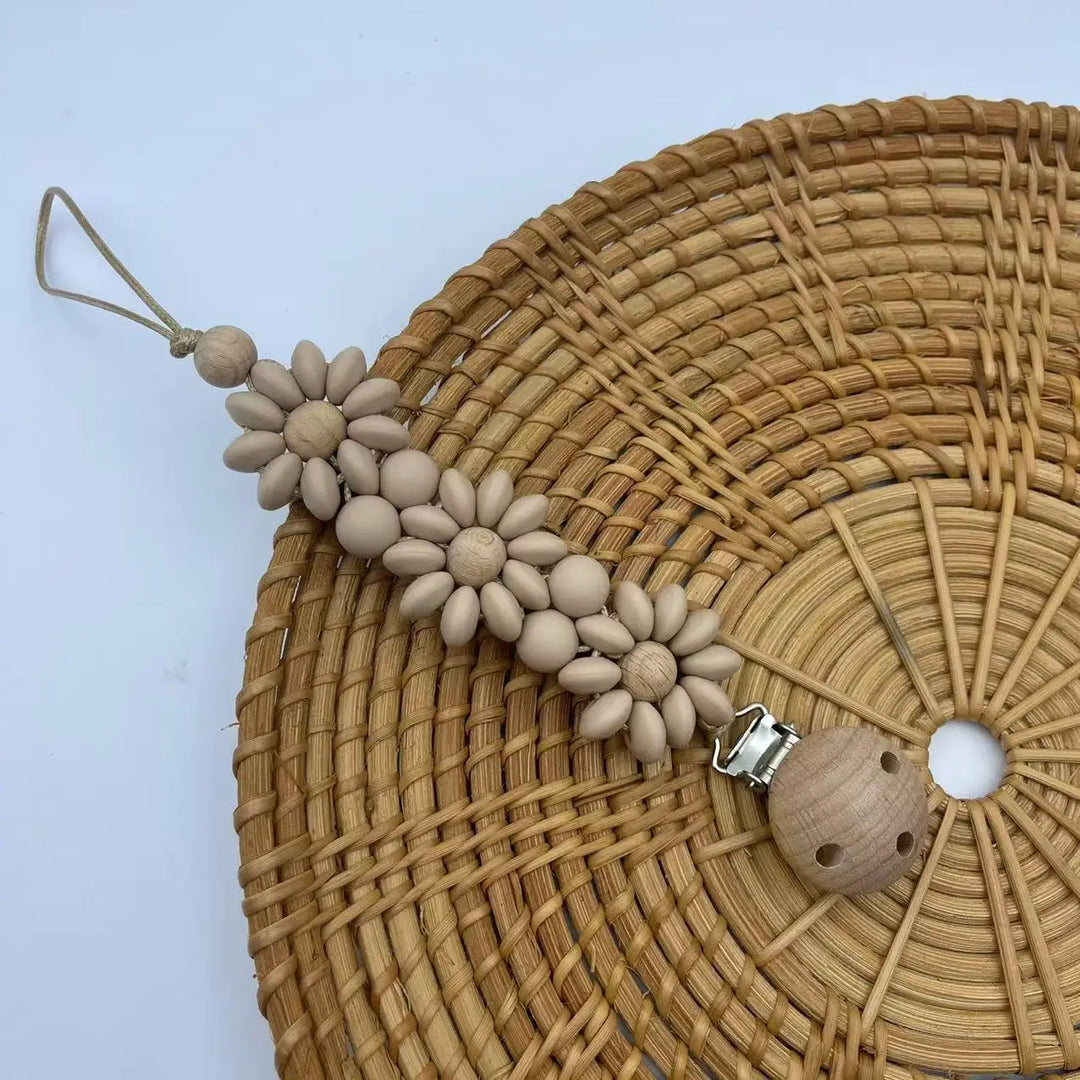 Attache-tétine fleur silicone Kalinatur™ – Douceur, sécurité & style bébé