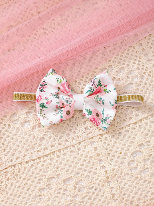 Bandeau bebe fleuri rose et blanc avec noeud en tissu floral, accessoire assorti a la tenue printaniere KaliNatur.
