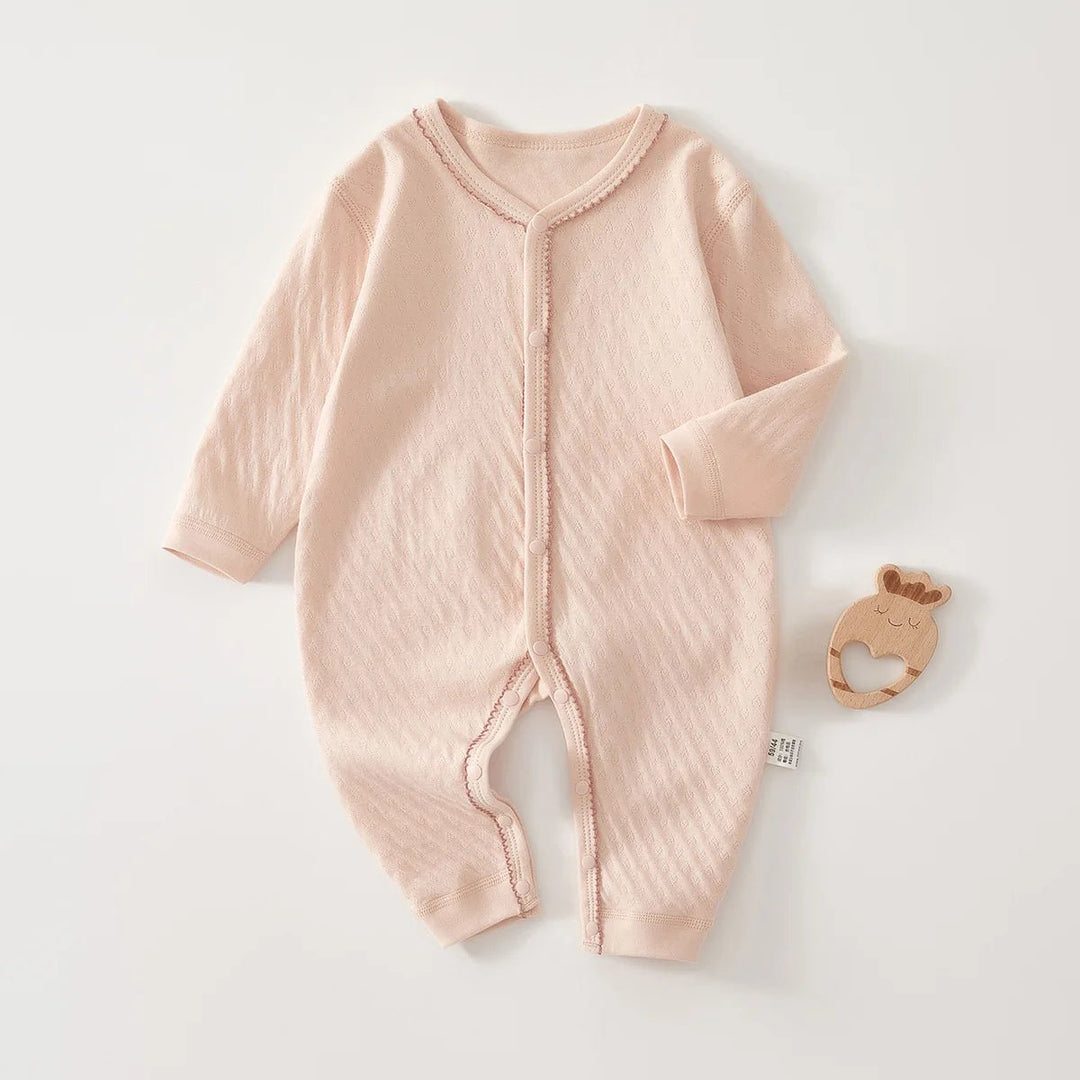 « Barboteuse bébé rose nude en coton doux – Kalinatur »