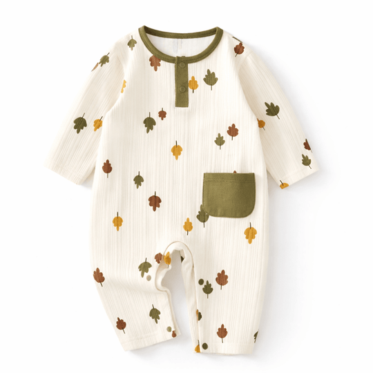 Barboteuse bébé en coton doux avec motifs feuilles, manches longues et boutons pression, vêtement confortable pour nourrisson 3-18 mois.