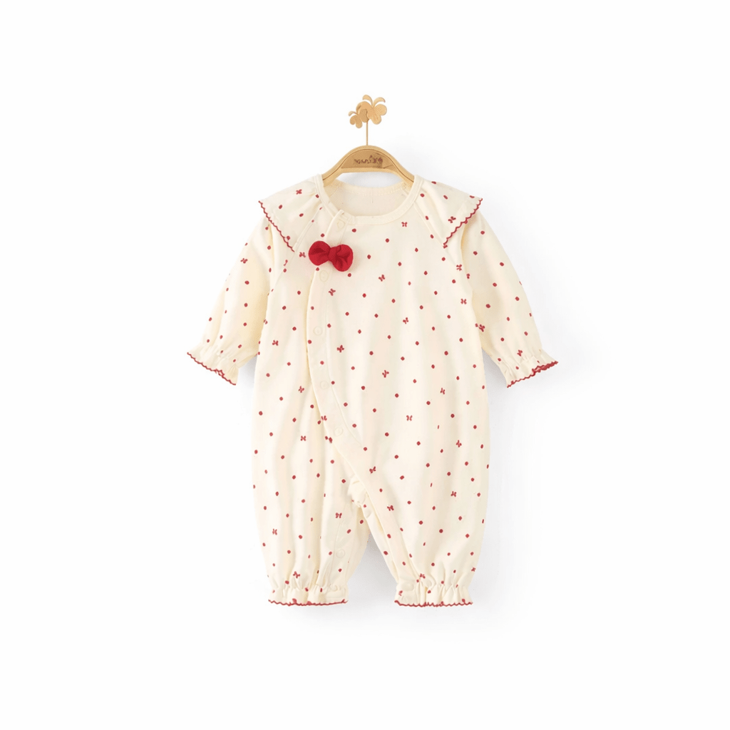 Barboteuse bébé fille blanche en coton doux à motif pois rouges avec col volanté et nœud, vêtement élégant pour enfant de 1 à 3 ans.