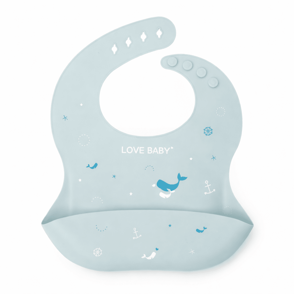 Bavoir bébé en silicone bleu avec poche récupératrice, décoré de motifs marins (baleines, ancres) et texte “Love Baby”, sur fond blanc