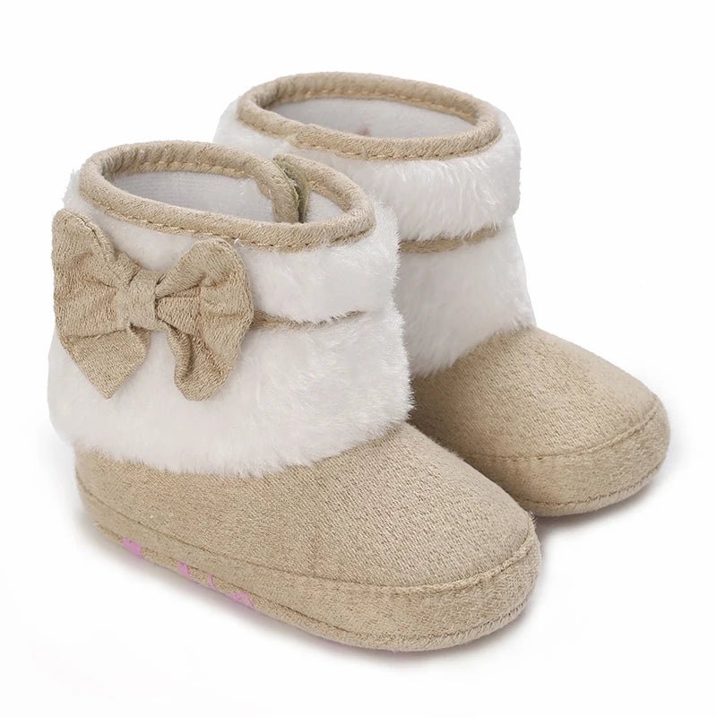  Bottines bébé beige avec grand nœud latéral et doublure blanche.
