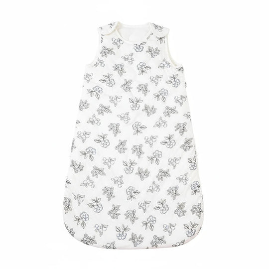 Gigoteuse bébé en coton blanc avec imprimés floraux noirs, douce et respirante, signée Kalinatur pour un sommeil paisible et sécurisé.