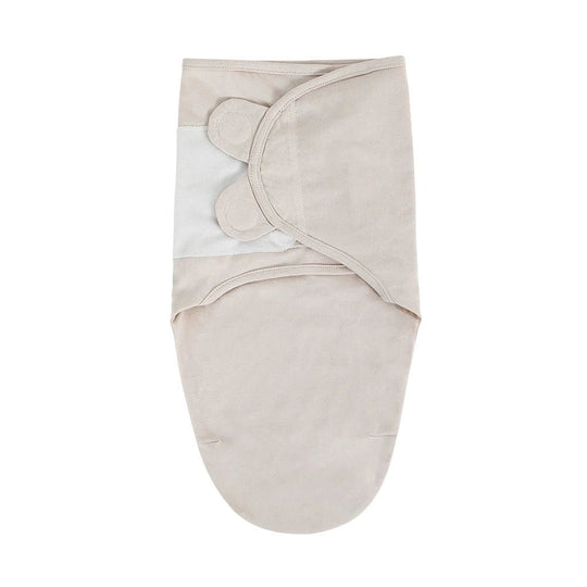 Gigoteuse d’emmaillotage pour bébé en coton beige uni, douce, sécurisée et facile à enfiler – Kalinatur.
