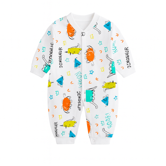 Pyjama bébé blanc imprimé dinosaures multicolores, étoiles et écritures ludiques.