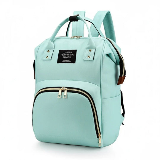 Sac à dos à langer vert menthe Kalinatur, design moderne et poches de rangement pratiques.