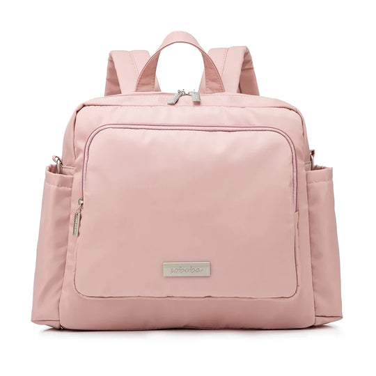 Sac à dos à langer rose poudré Kalinatur, modèle imperméable avec large poche frontale.