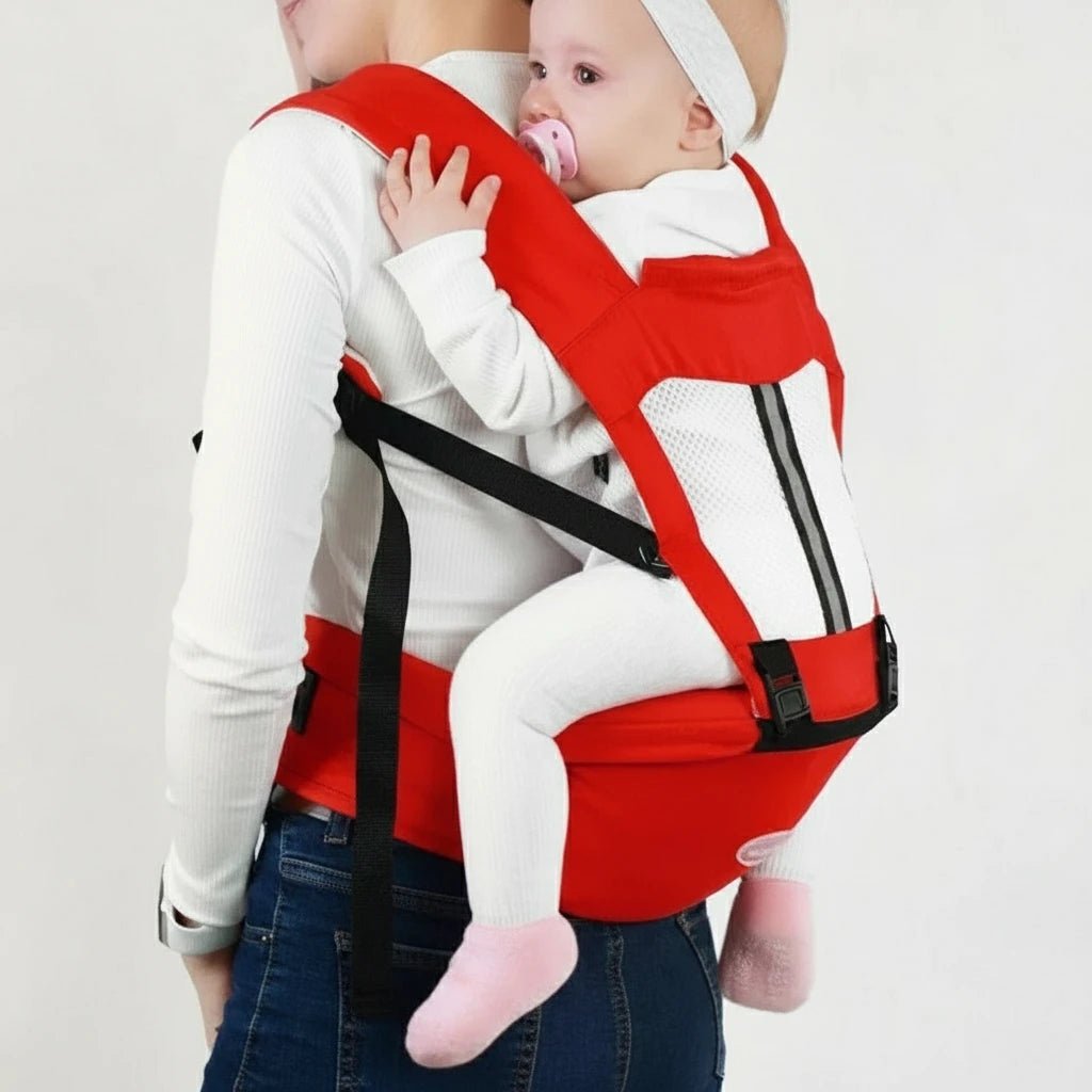Porte-bébé rouge Kalinatur utilisé en position dorsale pour un portage sécurisé et confortable.