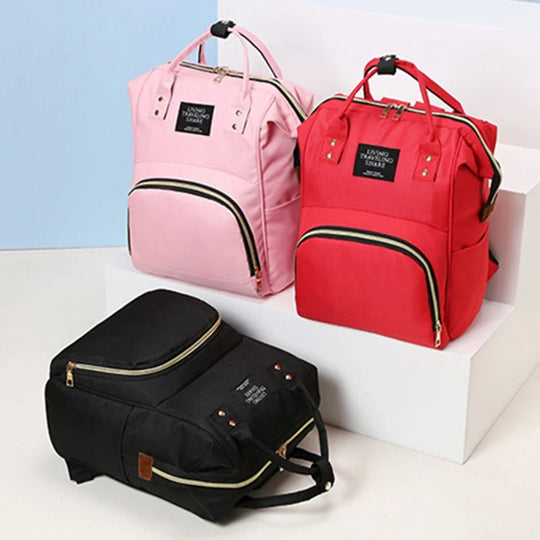 Lot de sacs à dos à langer Kalinatur en rose pâle, rouge et noir, présentation couleurs multiples.