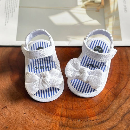 sandales bébé fille blanches avec nœud semelle souple premiers pas antidérapantes
