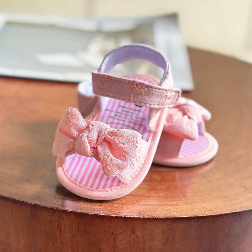 sandales bébé fille roses avec nœud et semelle souple pour premiers pas
