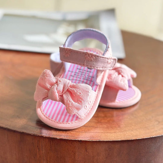 sandales bébé fille roses avec nœud et semelle souple pour premiers pas
