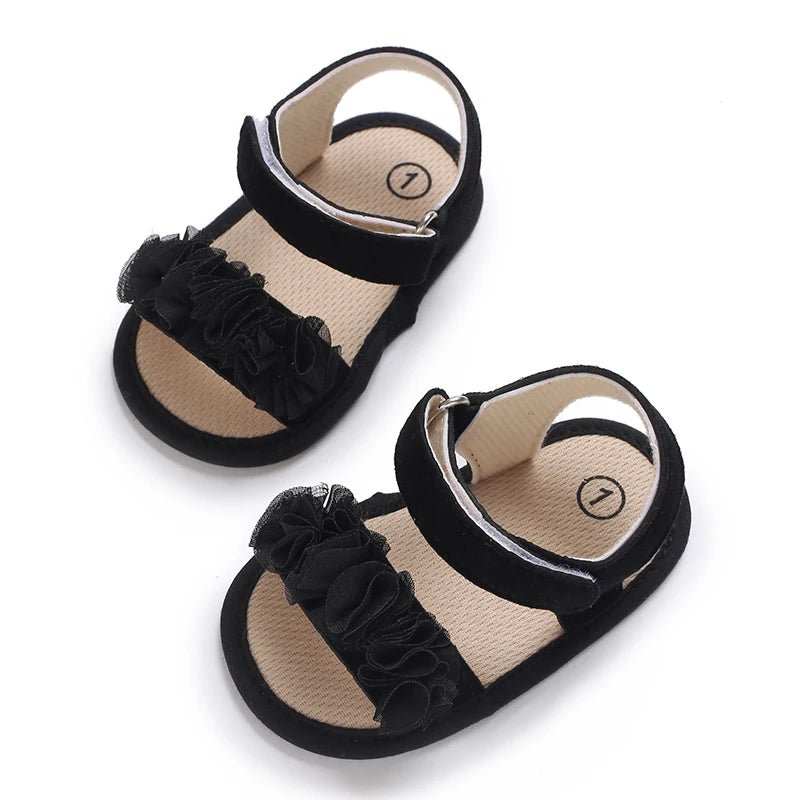 Sandales bébé fille noires avec fleurs en tissu et fermeture scratch, chaussures premiers pas à semelle souple antidérapante pour bébé de 0 à 18 mois
