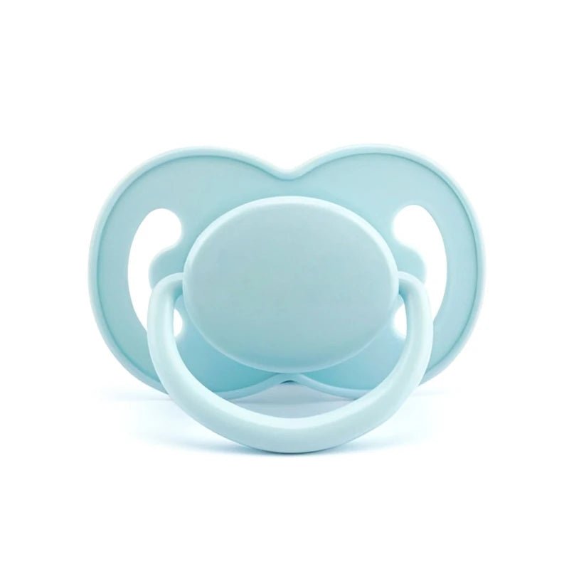 Tétine anatomique en silicone turquoise unie sur fond blanc – Kalinatur.